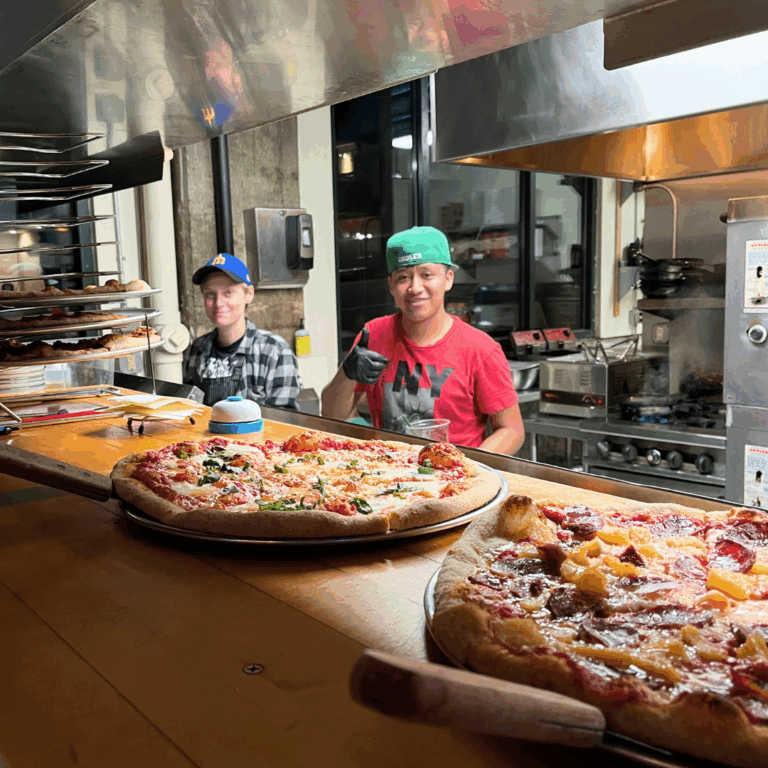 Chef Kelsey & Angel slingin' pies at Jackson Street Pizza Lounge. Photo courtesy of Jackson Street Pizza Lounge.