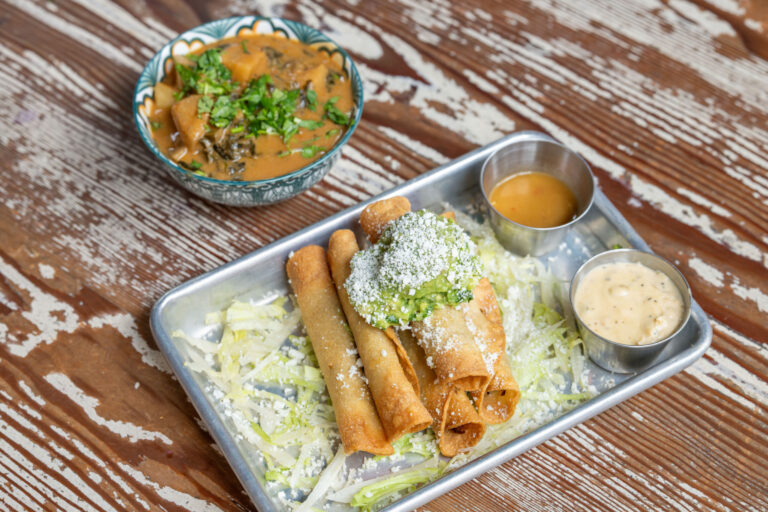 Carnitas Taquitos, Cotija, Guacamole, Situ Sauce, Green Hatch Chile Queso; (2) West African Peanut Stew. Photo by Star Chefs.