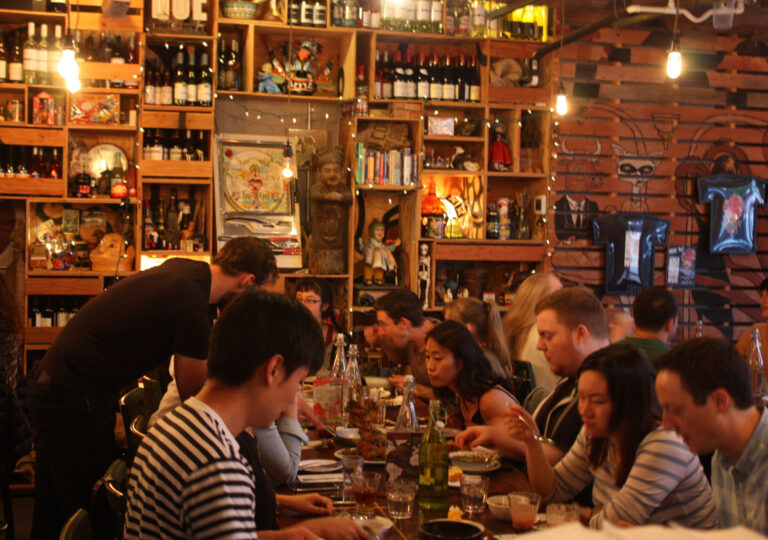 A lively evening at Nue Seattle, with guests dining together in our eclectic, globally inspired space. Photo by Chris Cvetkovich.